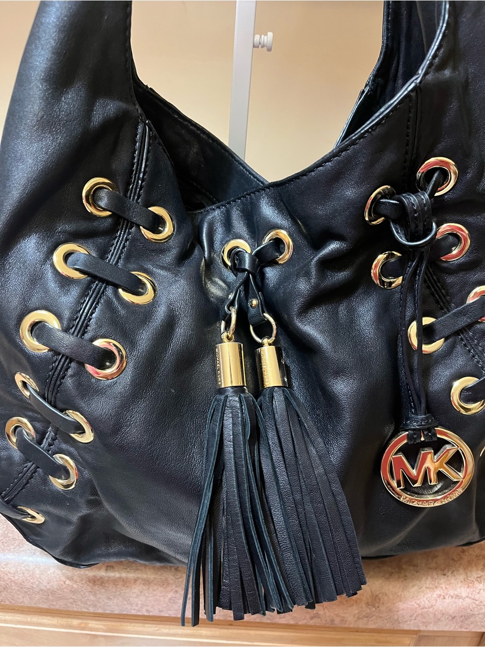 Michael Kors Black Leather Shoulder Hobo with Gold Hardware and Tassels